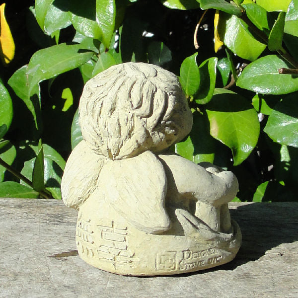 meditating cherub statue
